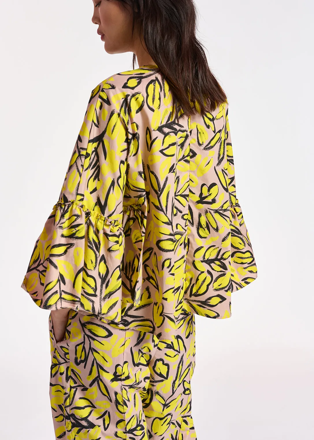 Beige floral printed top with ruffled sleeves