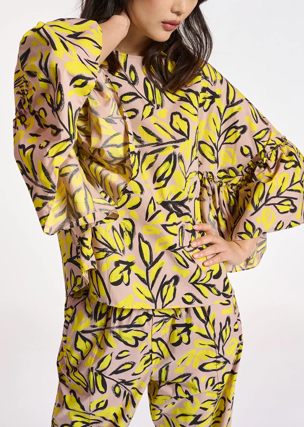 Beige floral printed top with ruffled sleeves