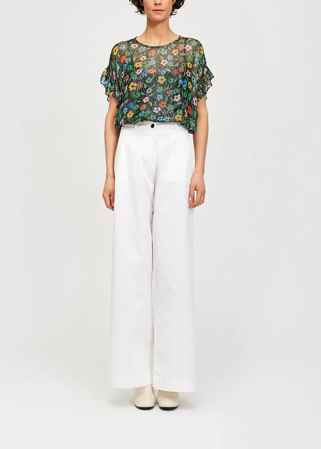 Black floral print top with ruffled sleeves