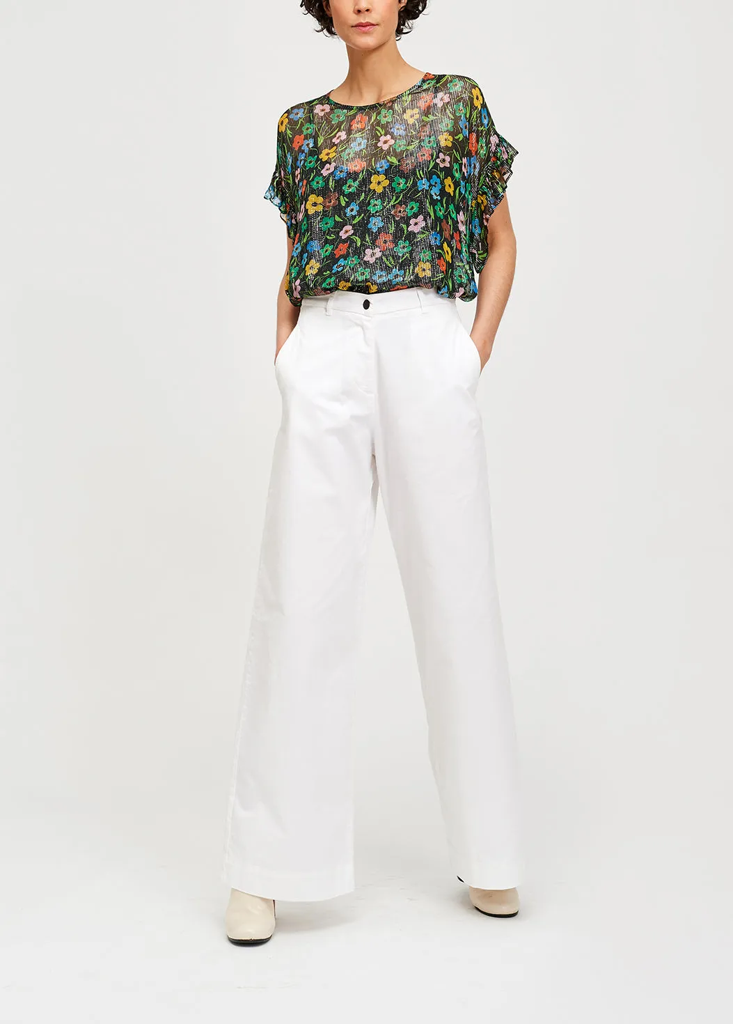 Black floral print top with ruffled sleeves