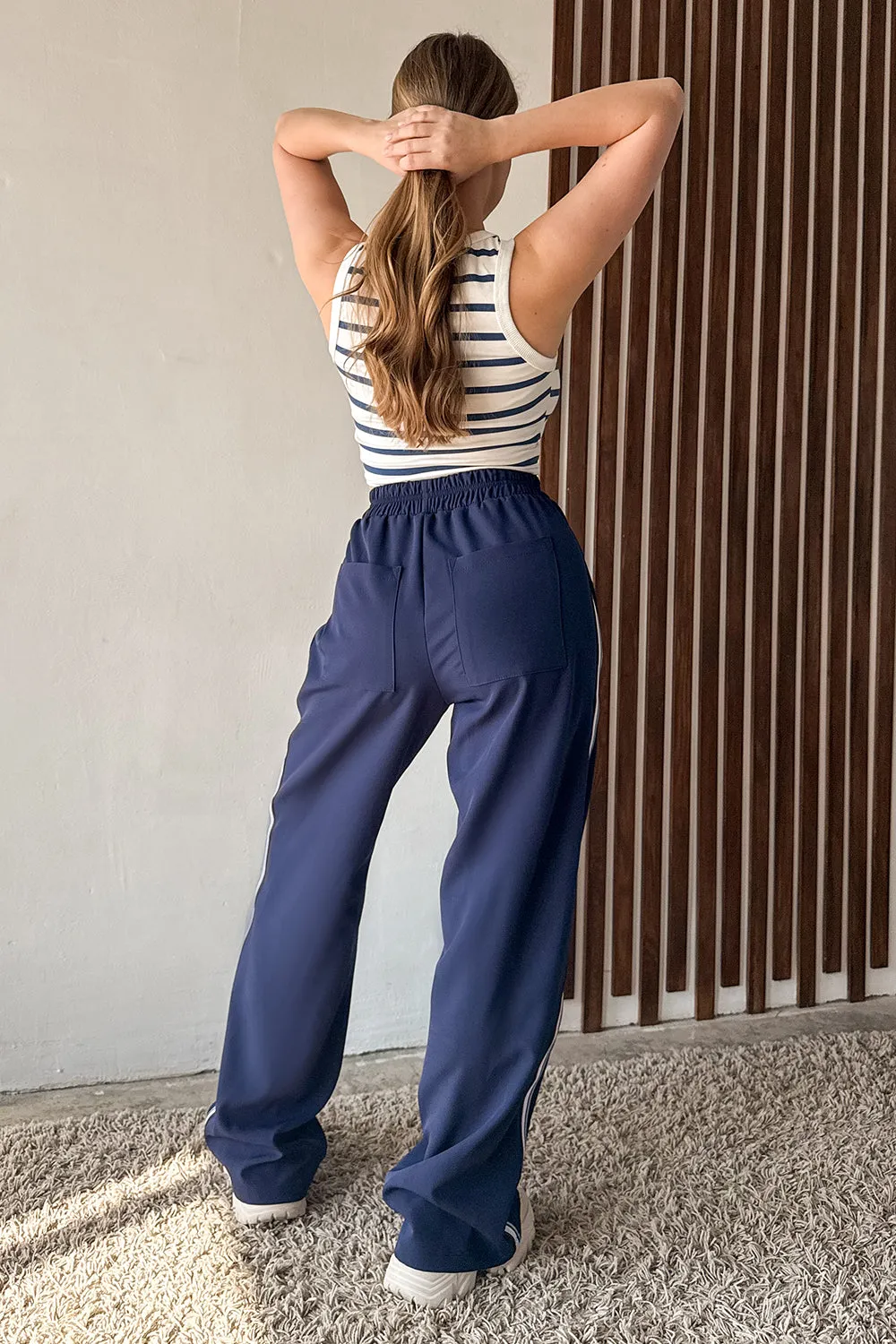 Blue trousers with elastic waistband and stripes