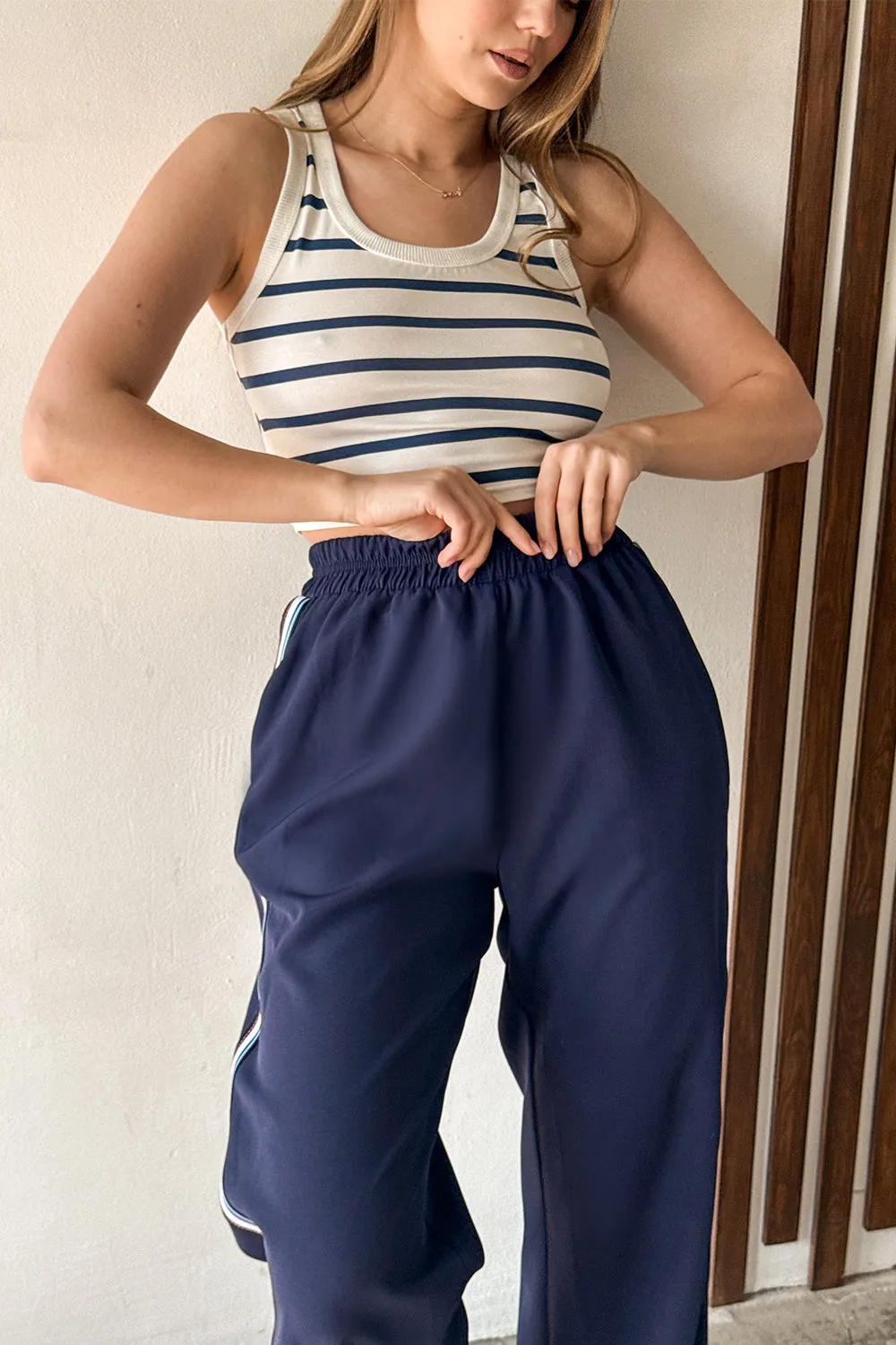 Blue trousers with elastic waistband and stripes