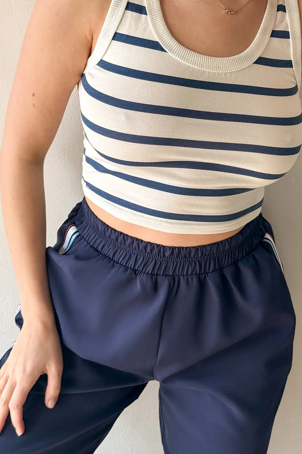Blue trousers with elastic waistband and stripes