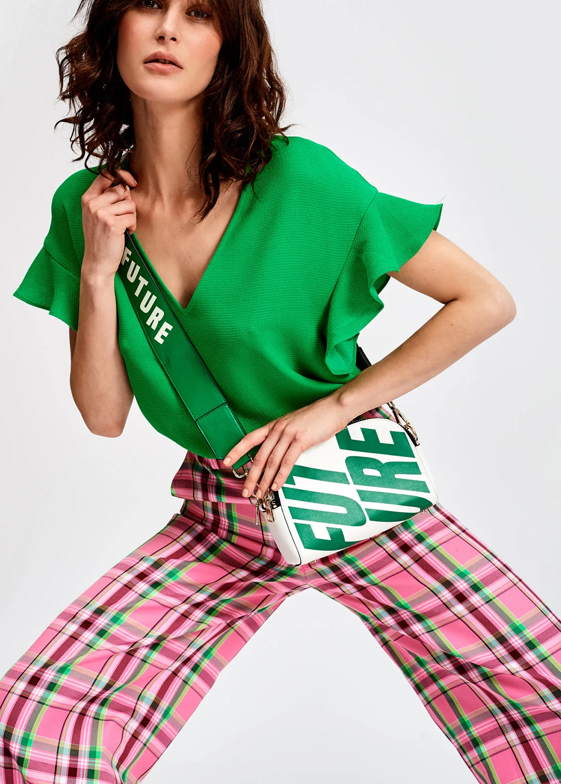 Green v-neck top with ruffled sleeves