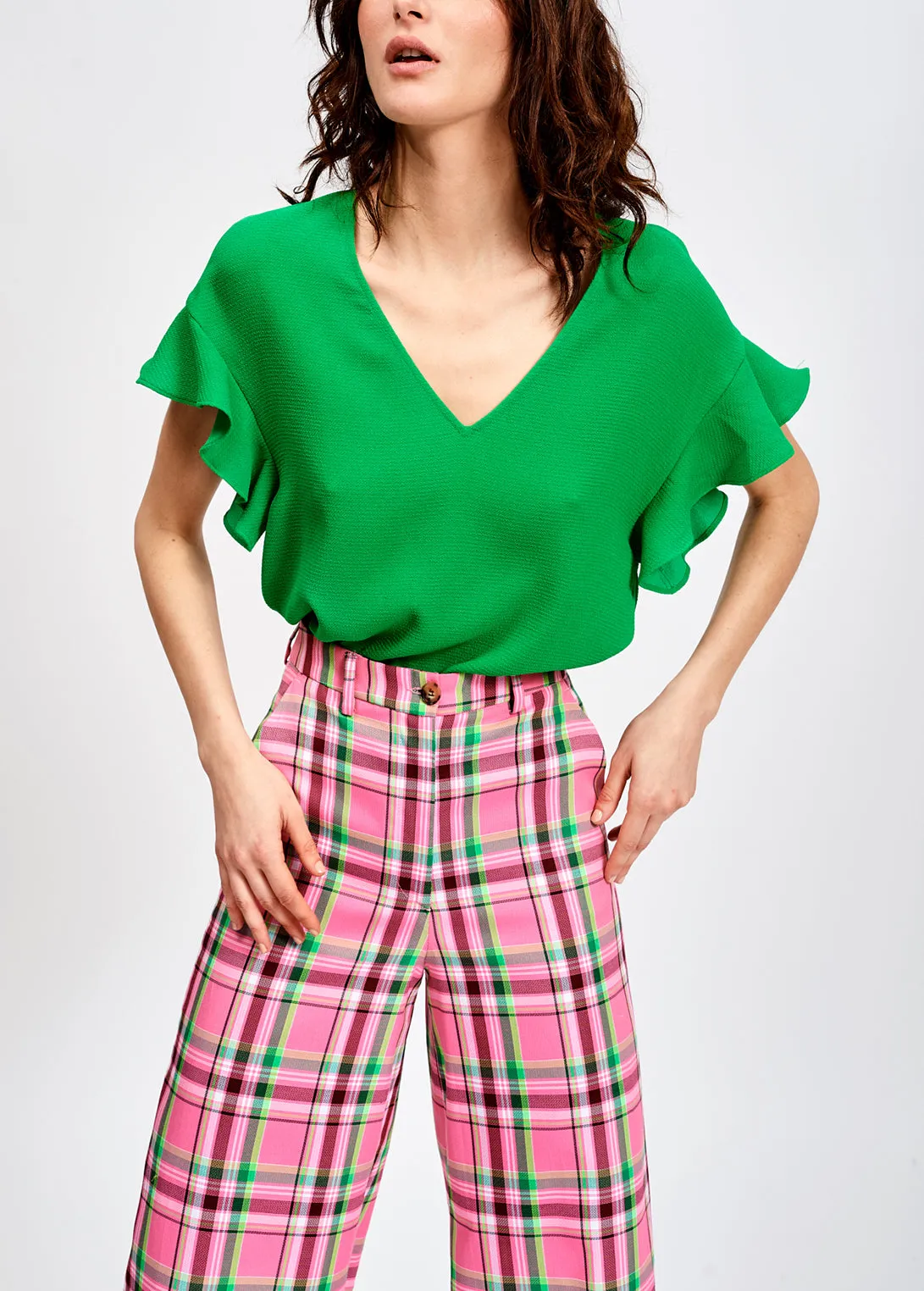 Green v-neck top with ruffled sleeves