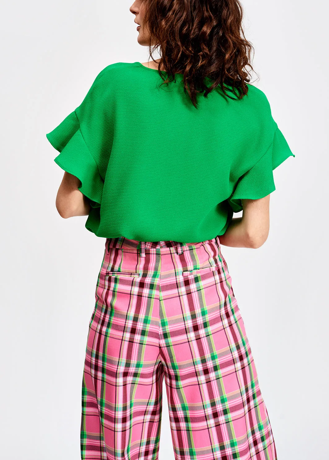 Green v-neck top with ruffled sleeves