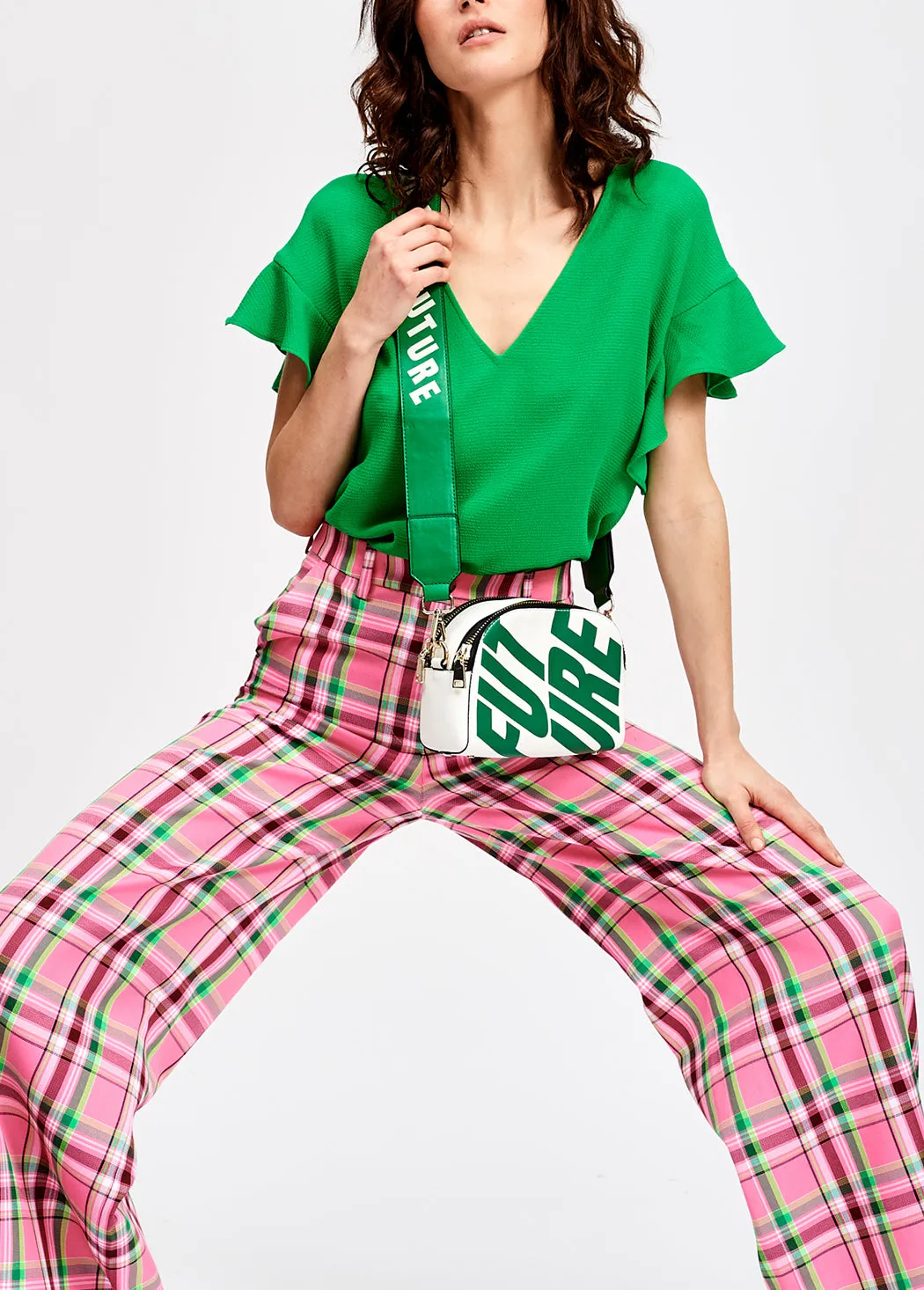 Green v-neck top with ruffled sleeves