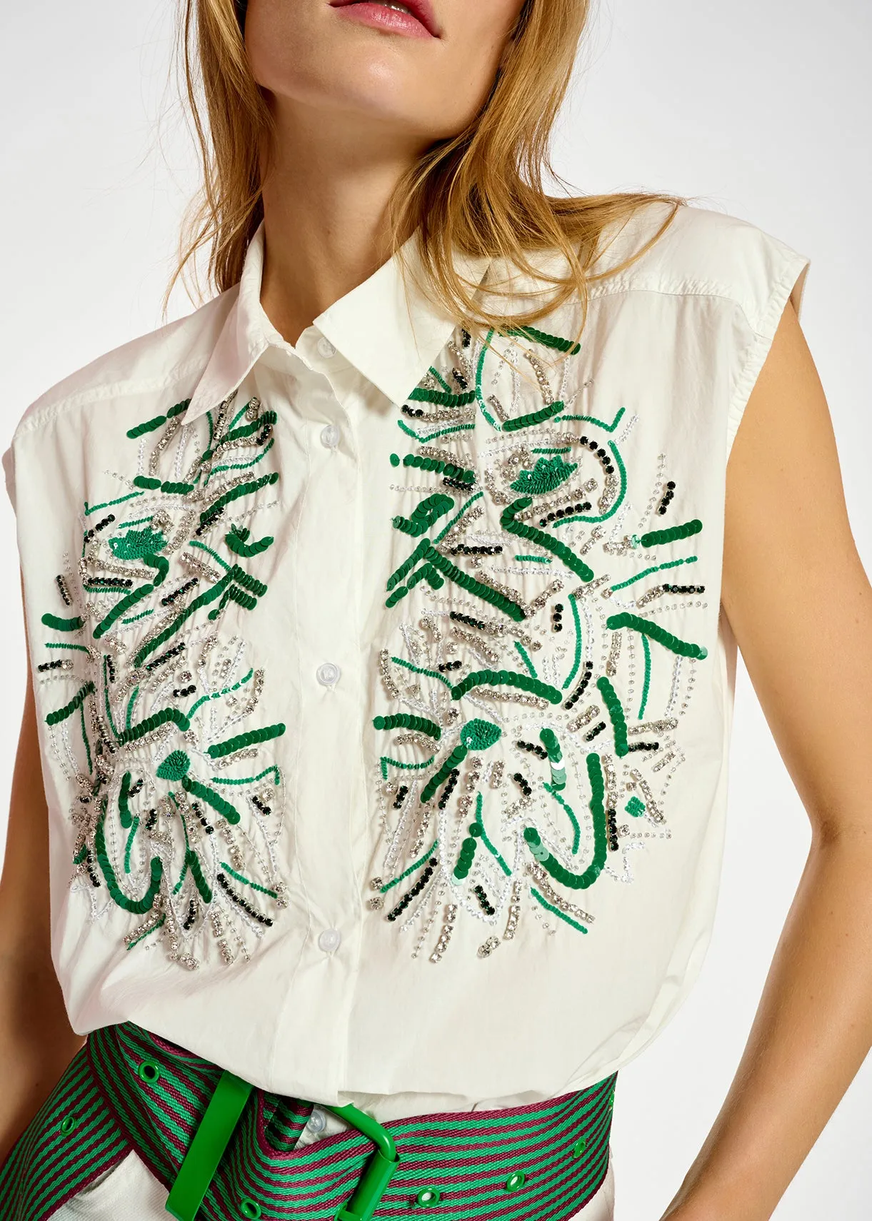 White sequin and rhinestone-embellished sleeveless shirt